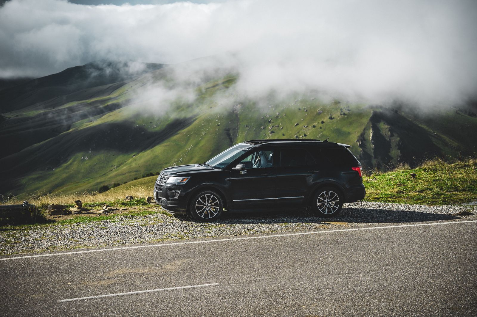 Black SUV on a Texas Hill Country highway