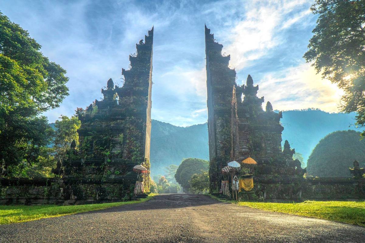 Coastal road in south Bali leading to a villa gate