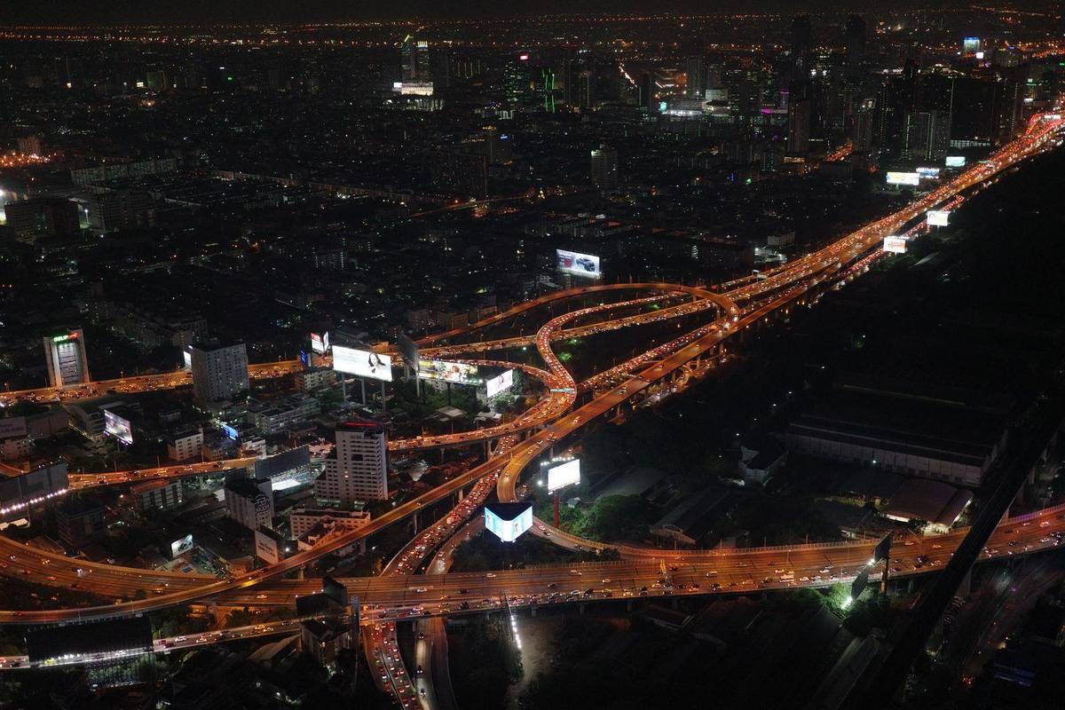 Bangkok elevated expressway at night with traffic below