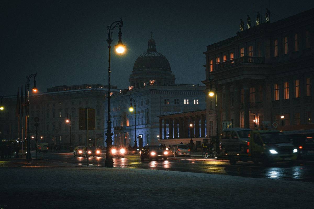 Black sedan on a Berlin street at night