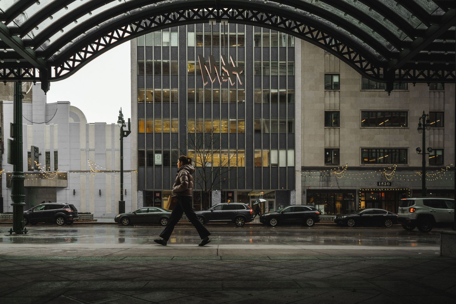 Black sedan on a downtown Detroit street