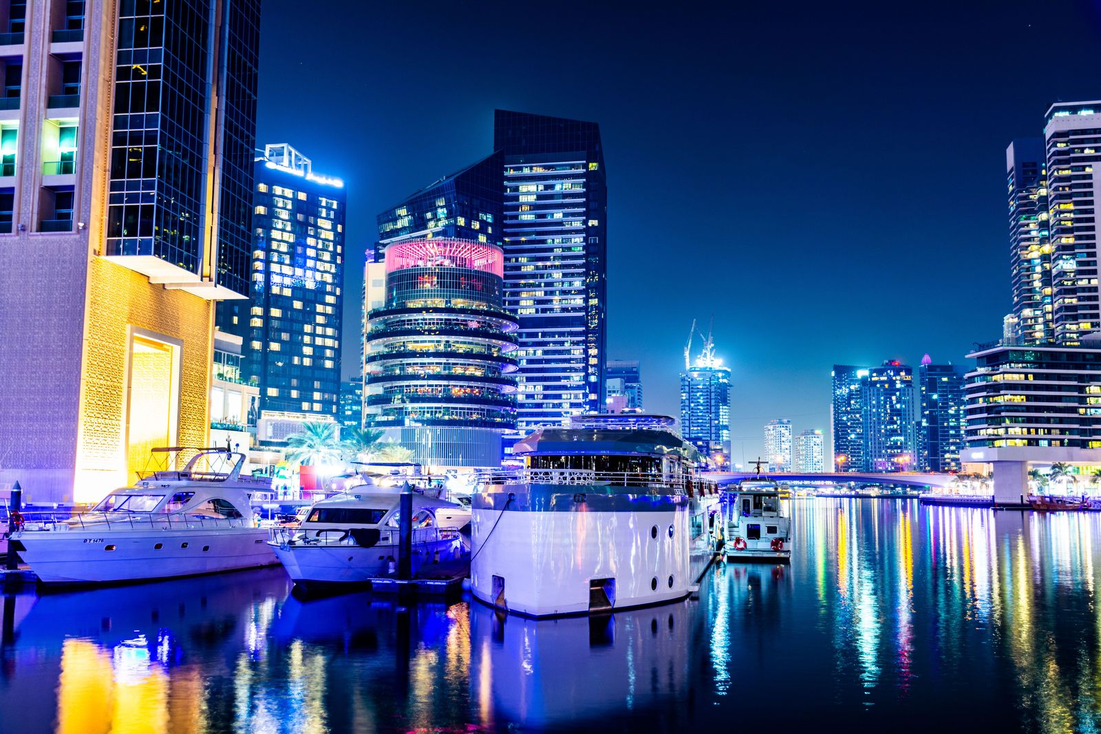 Luxury sedan waiting in Dubai Marina in the evening