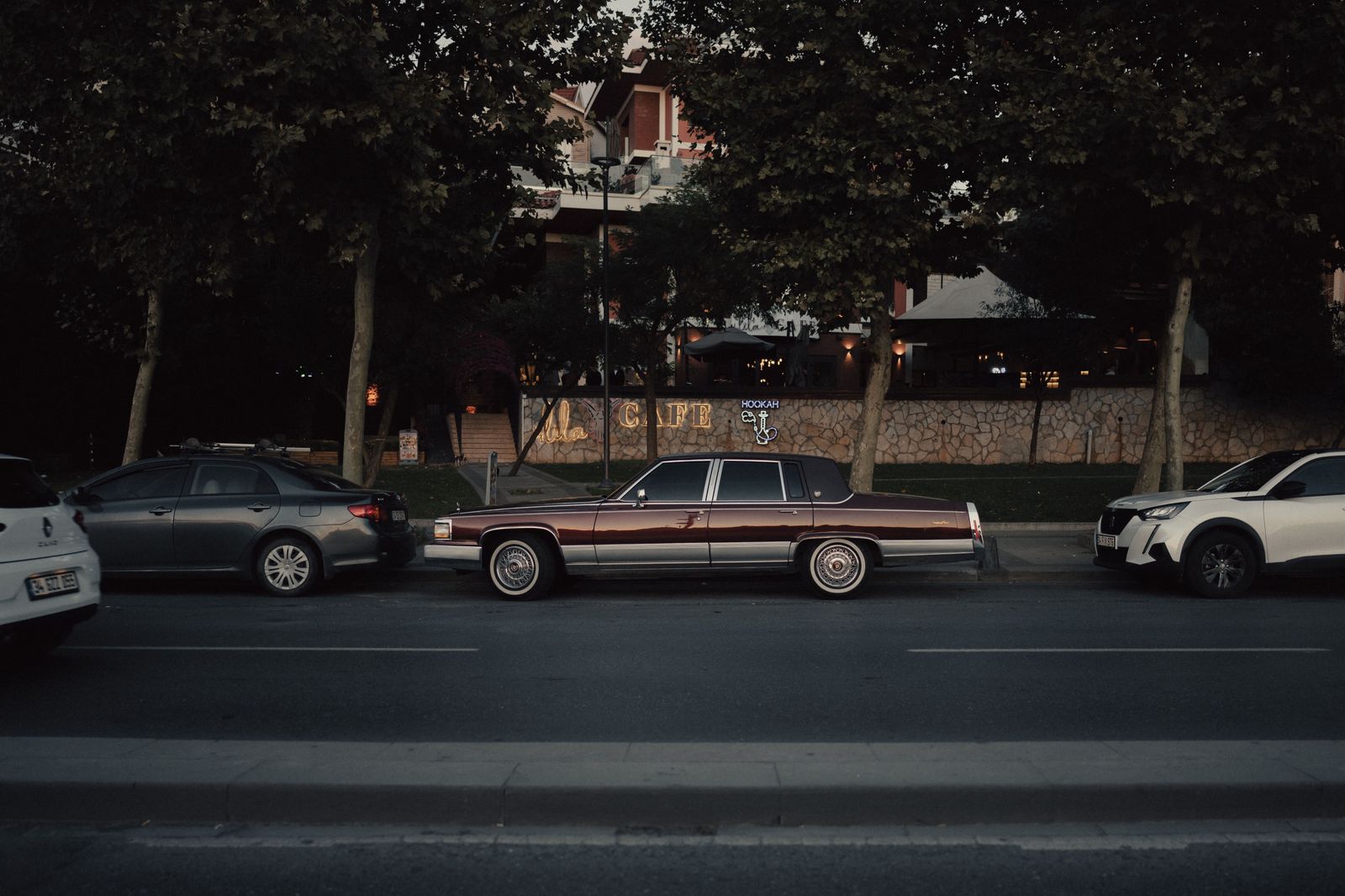 Black sedan on a waterfront road beside the Bosphorus in Istanbul
