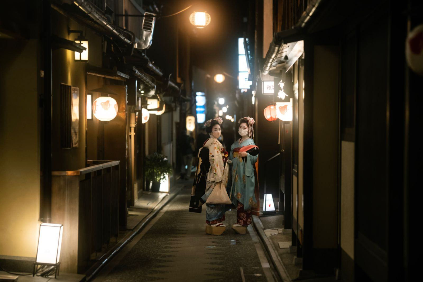 Lantern-lit lane in Kyoto's Gion district at dusk