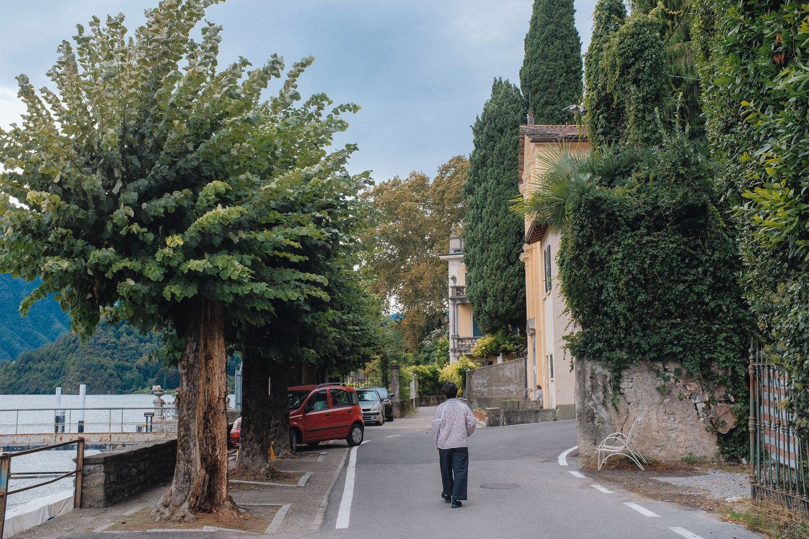 Narrow lakeside road through a village on Lake Como