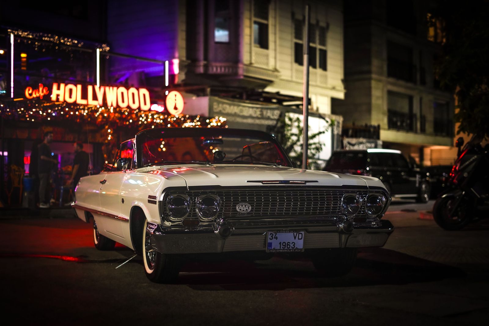 Black stretch limousine on a Hollywood Hills road at night
