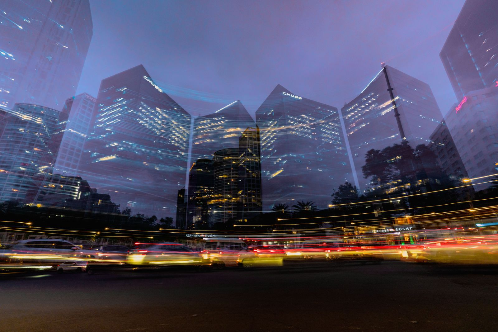Office towers on the Paseo de la Castellana at night
