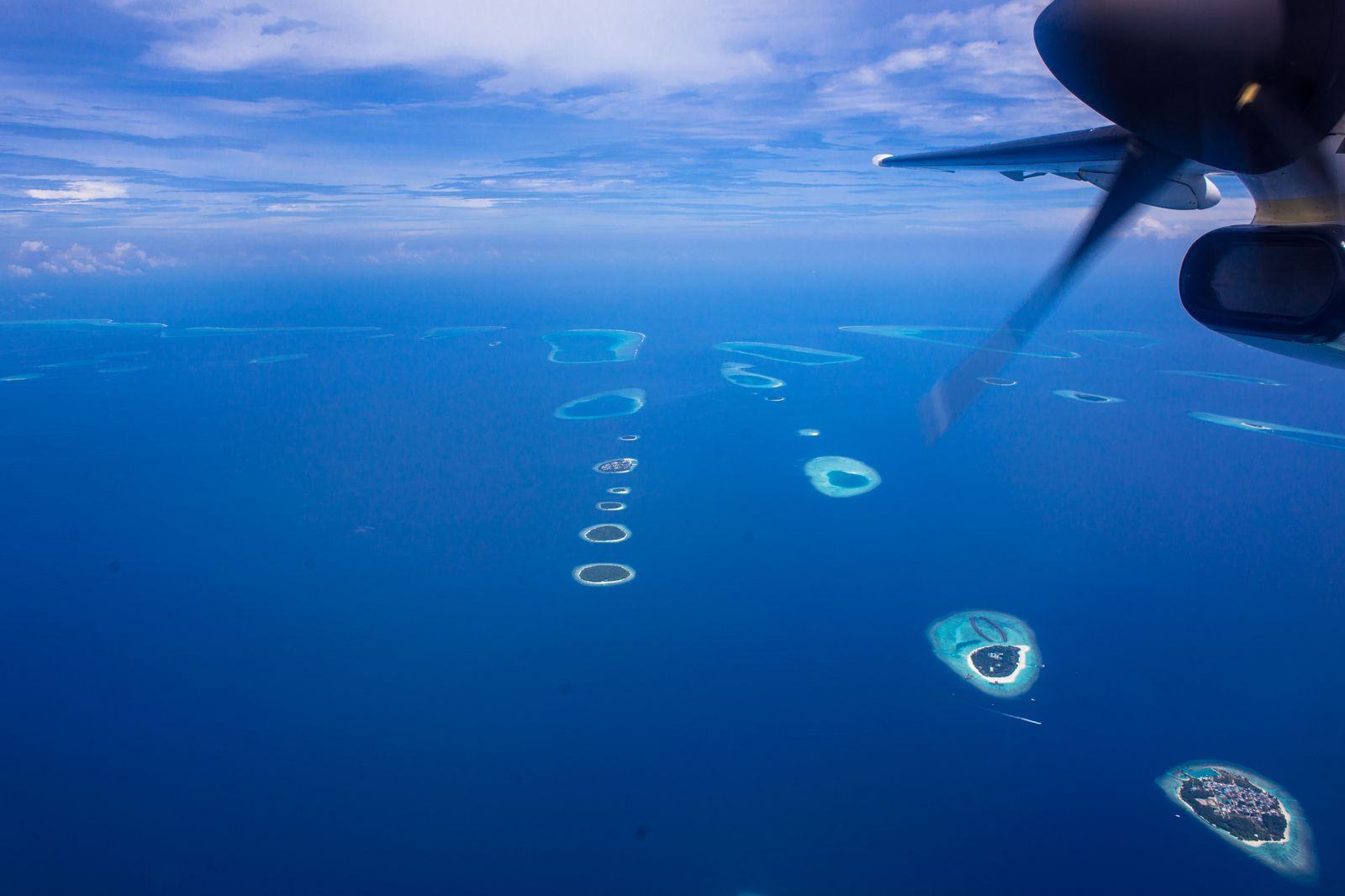 Seaplane on a turquoise Maldives lagoon