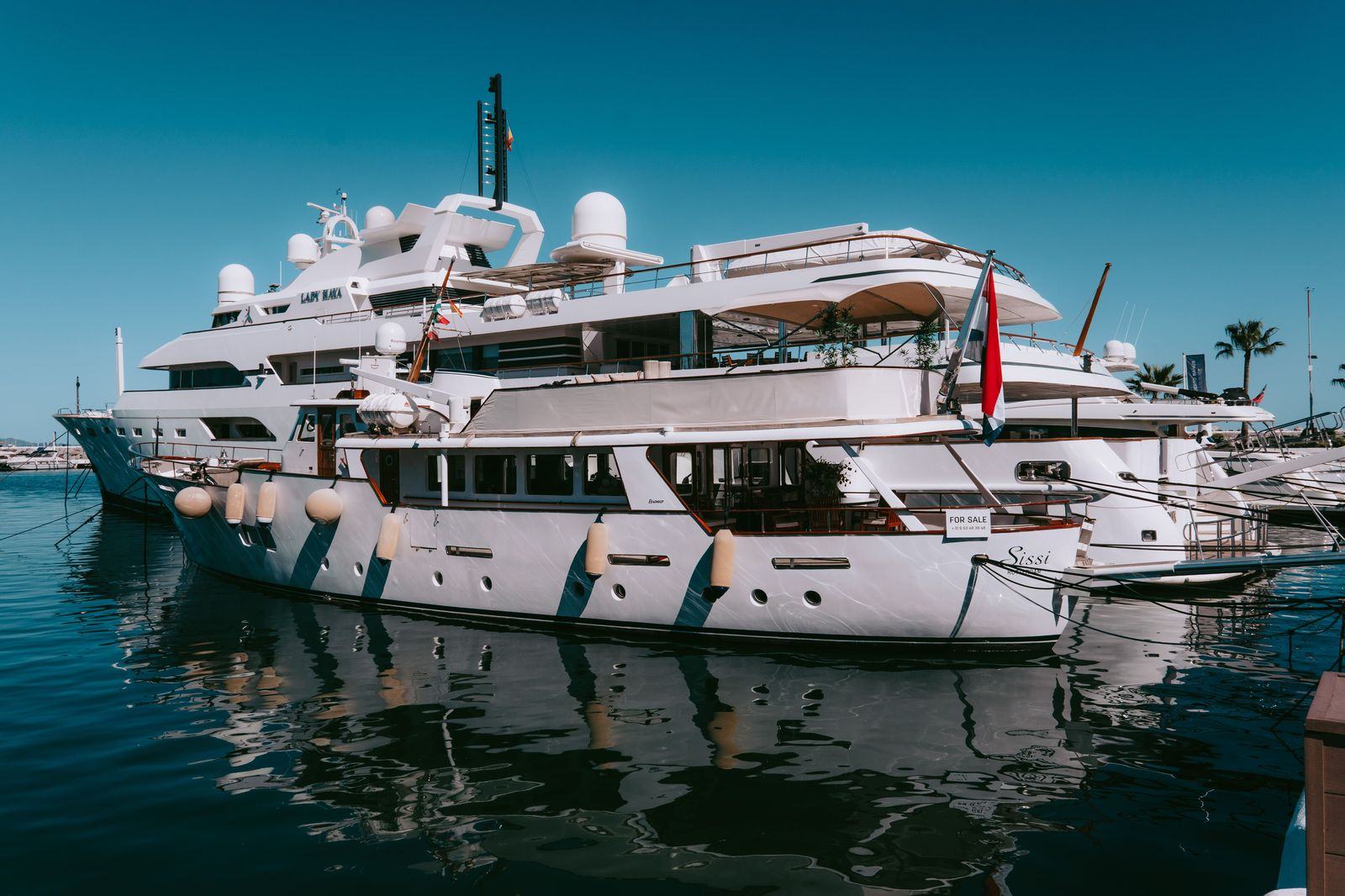 Yachts lit up at night in the Puerto Banus marina