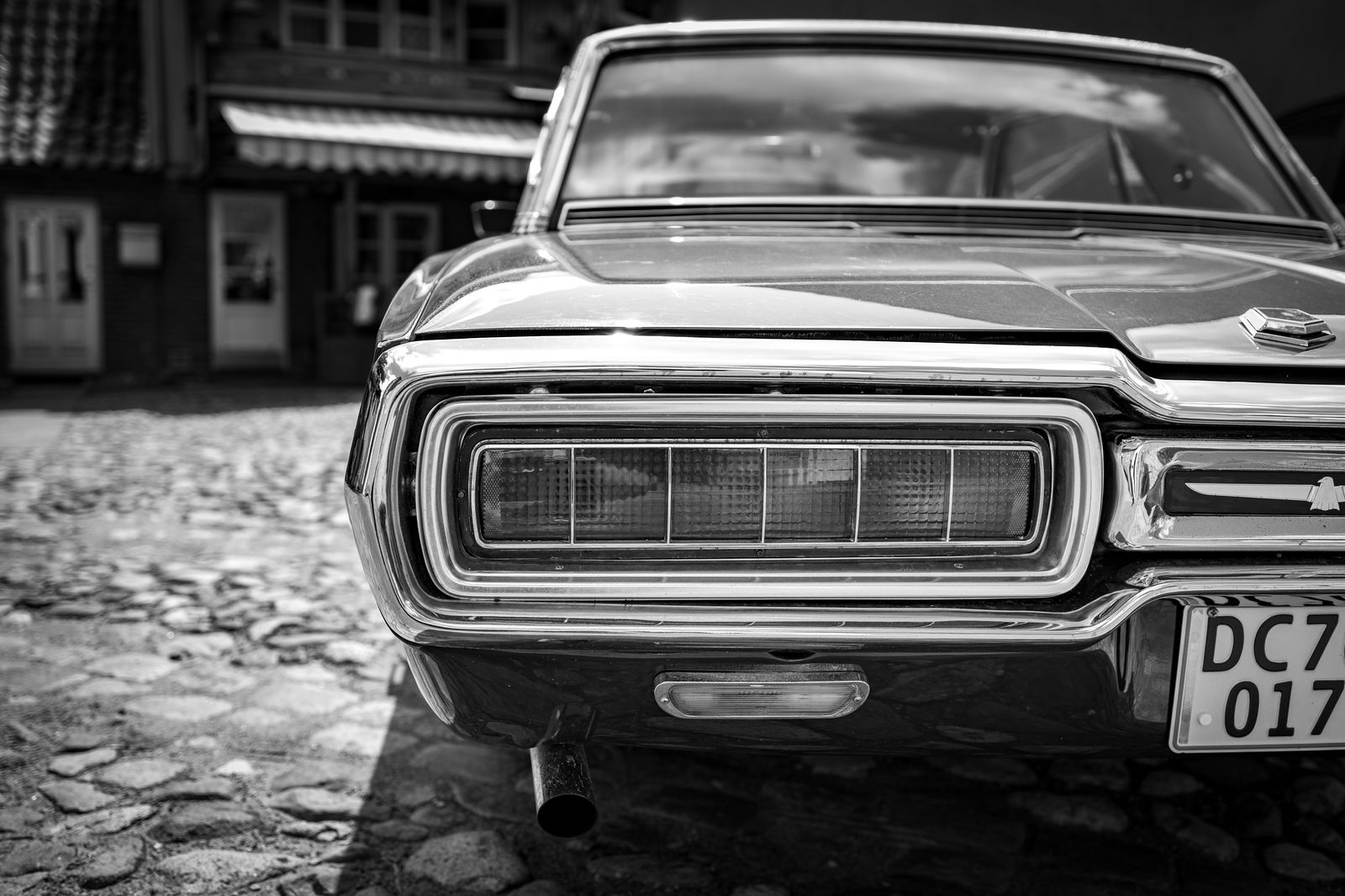 Black car on a cobbled street in Old Montreal