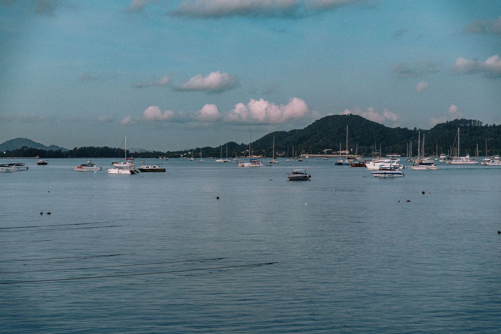 Yachts moored at a Phuket marina at dusk