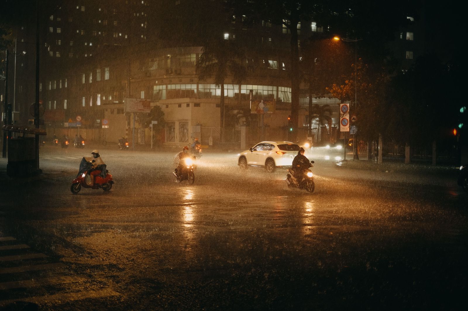 Chauffeured sedan in Sao Paulo traffic on a rainy night