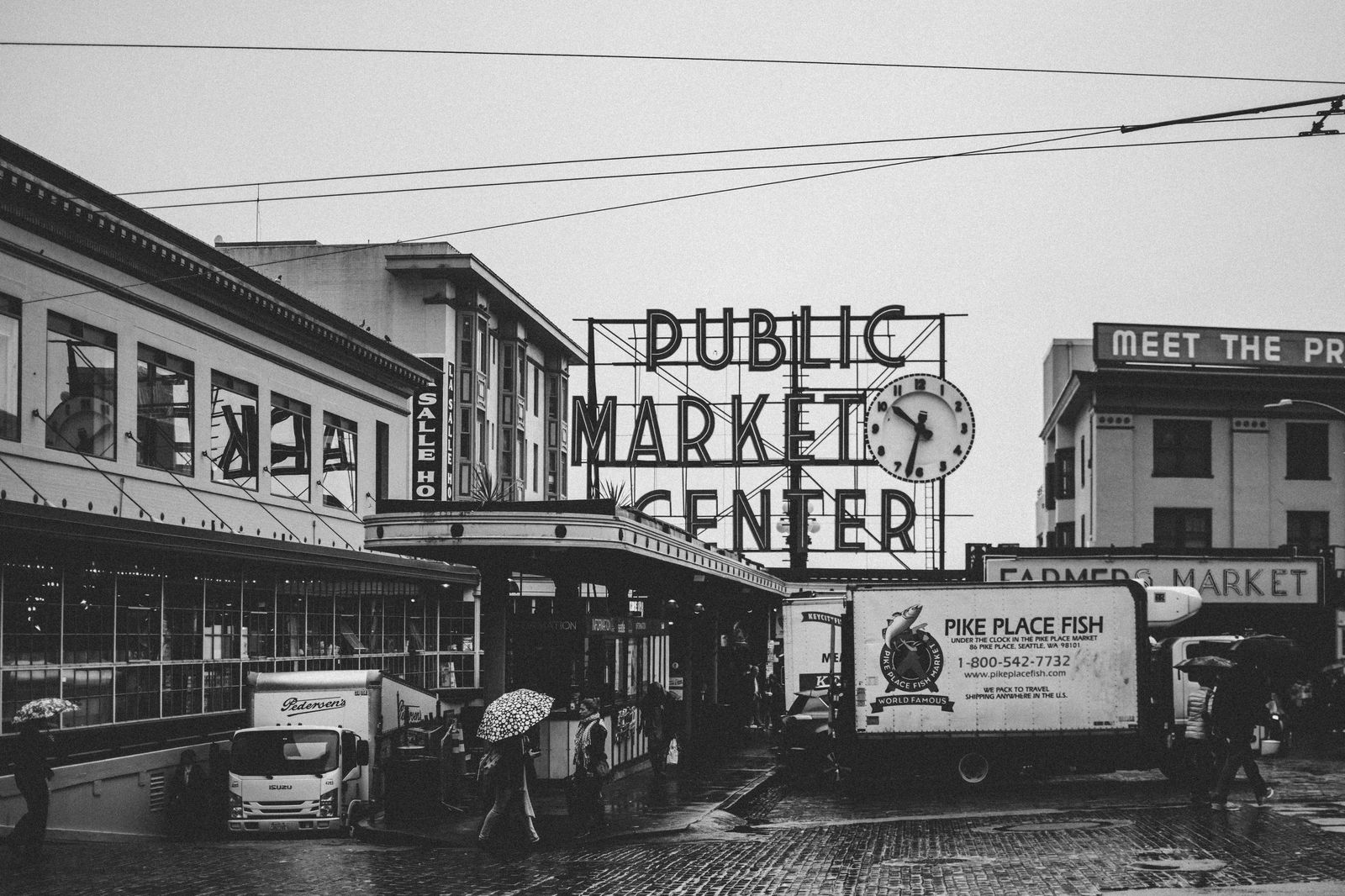 Black car on a rainy Seattle waterfront street
