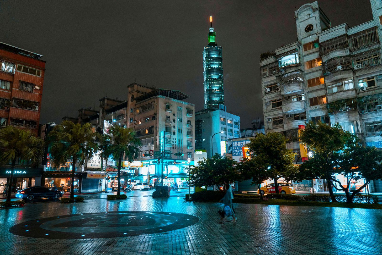 Taipei city street at night after rain