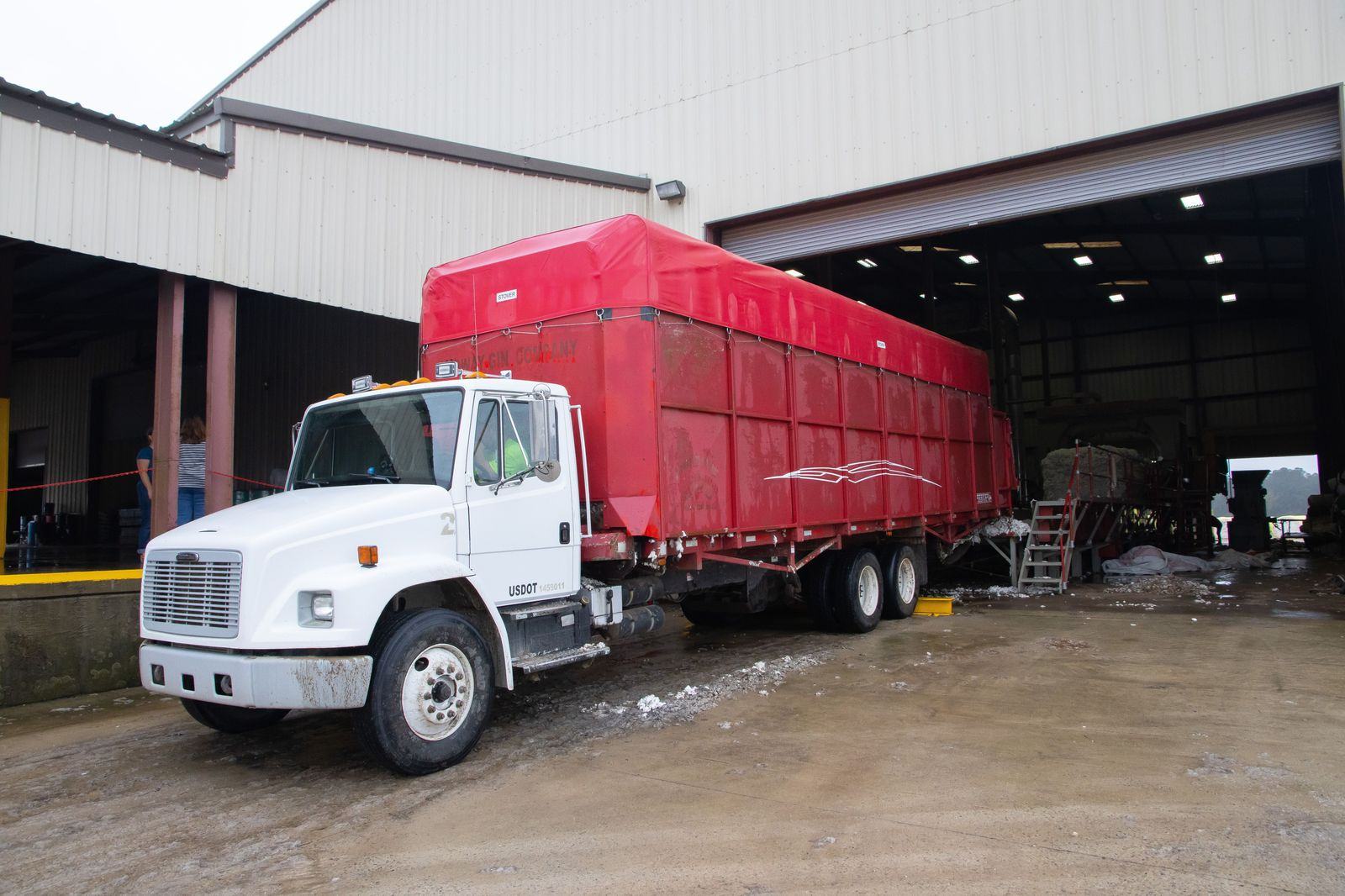 Tour vehicles parked at an arena loading dock