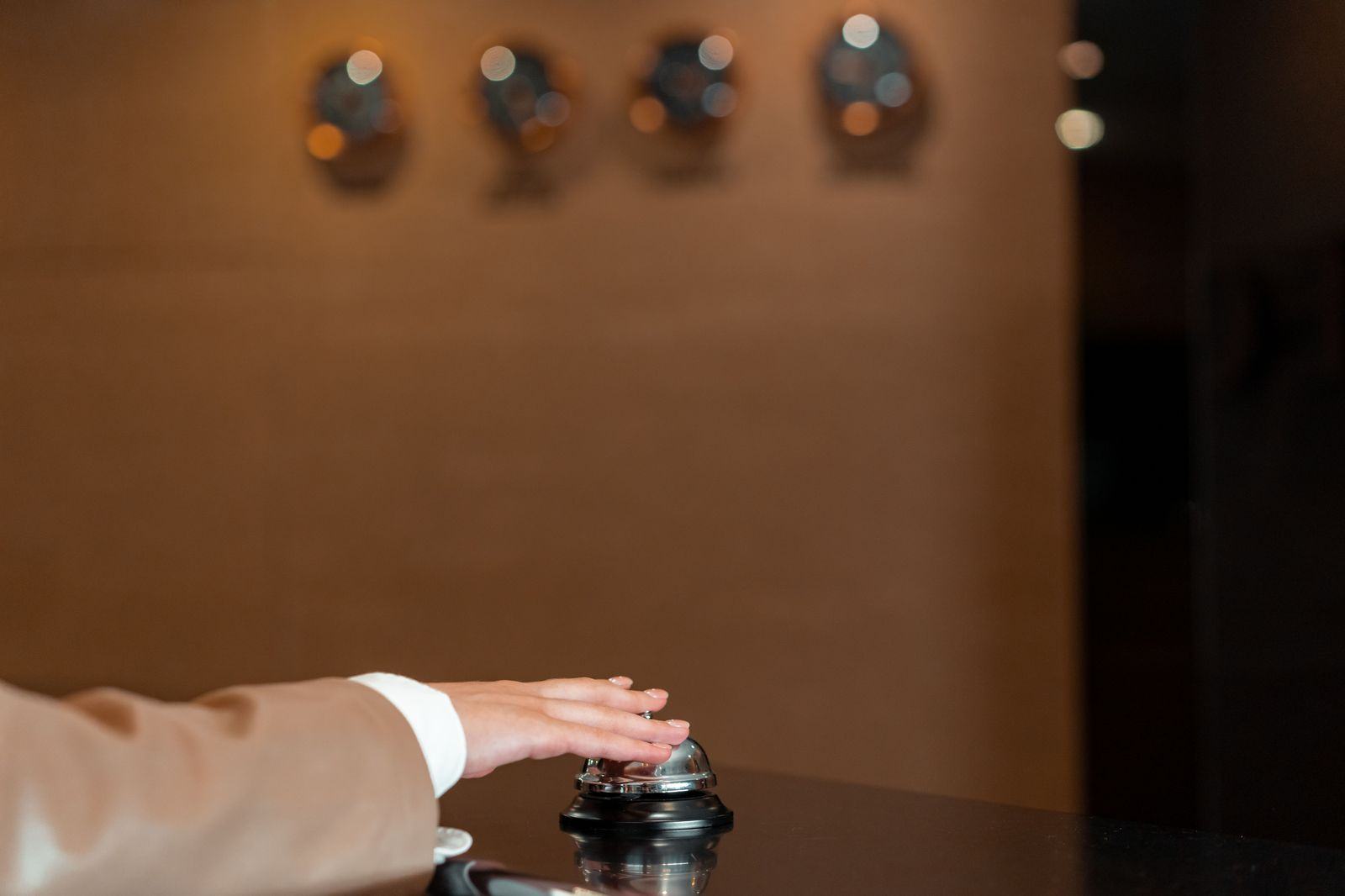 Hotel concierge desk in a lobby with a guest being assisted